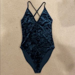 Green velvet body suit.